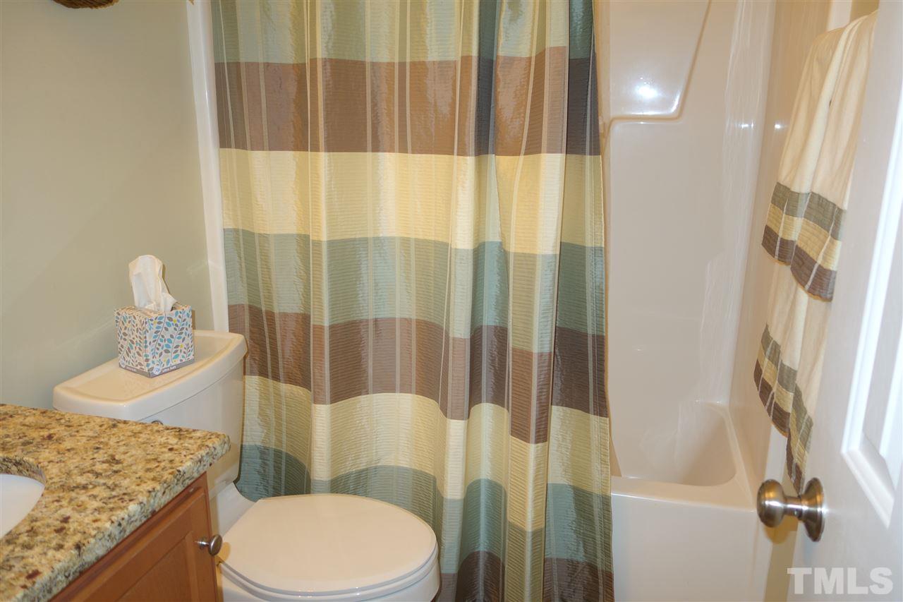 63 West Waycliff Road Henderson, NC 27537 - Photo 18 of 24 Hall bath with tub with over head shower