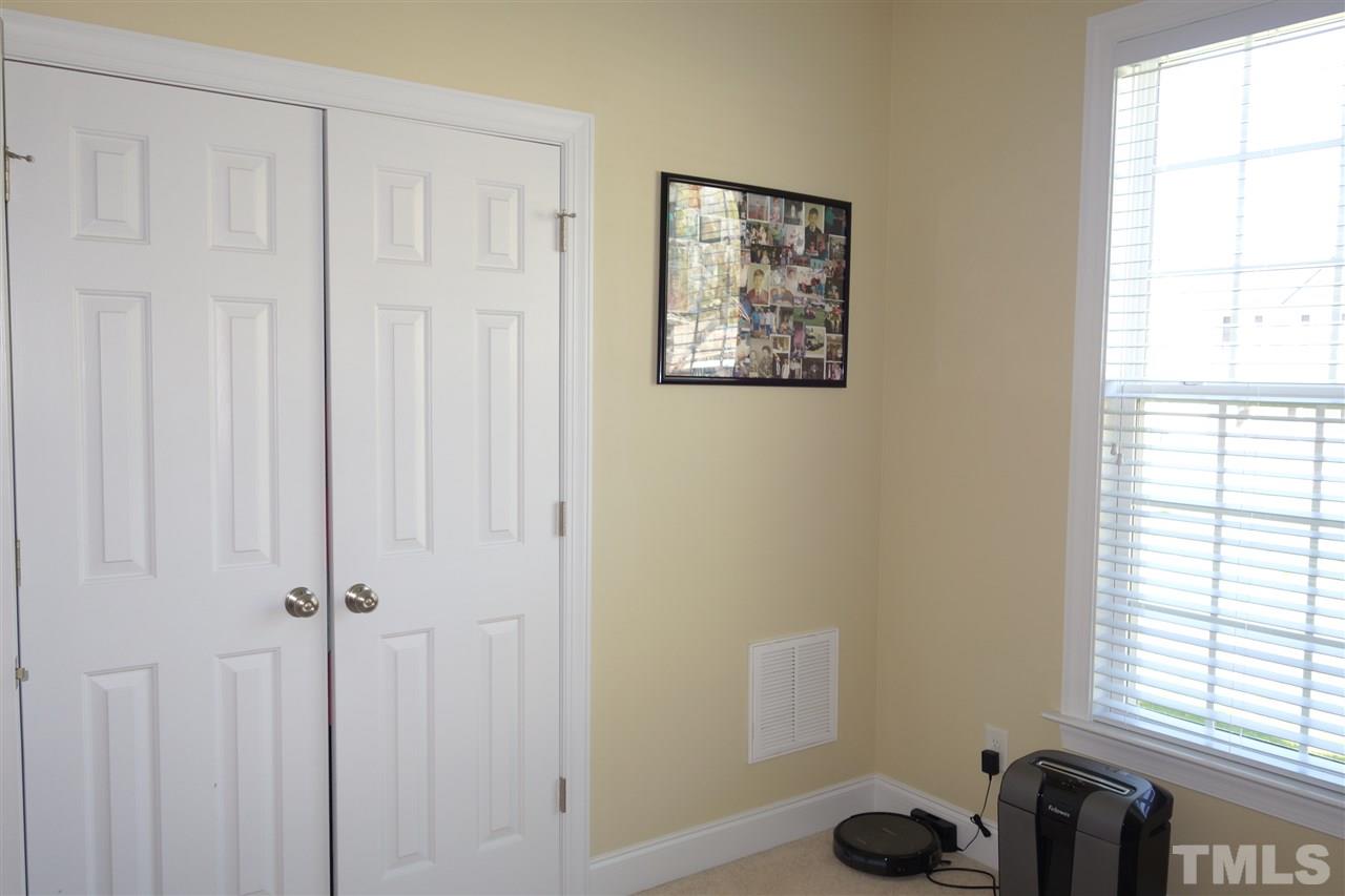 63 West Waycliff Road Henderson, NC 27537 - Photo 20 of 24 The third bedroom also has a double door closet