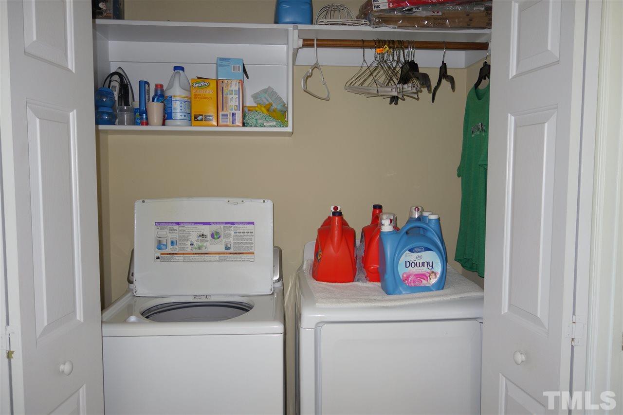 63 West Waycliff Road Henderson, NC 27537 - Photo 21 of 24 At the end of the hall is the laundry closet with shelves above