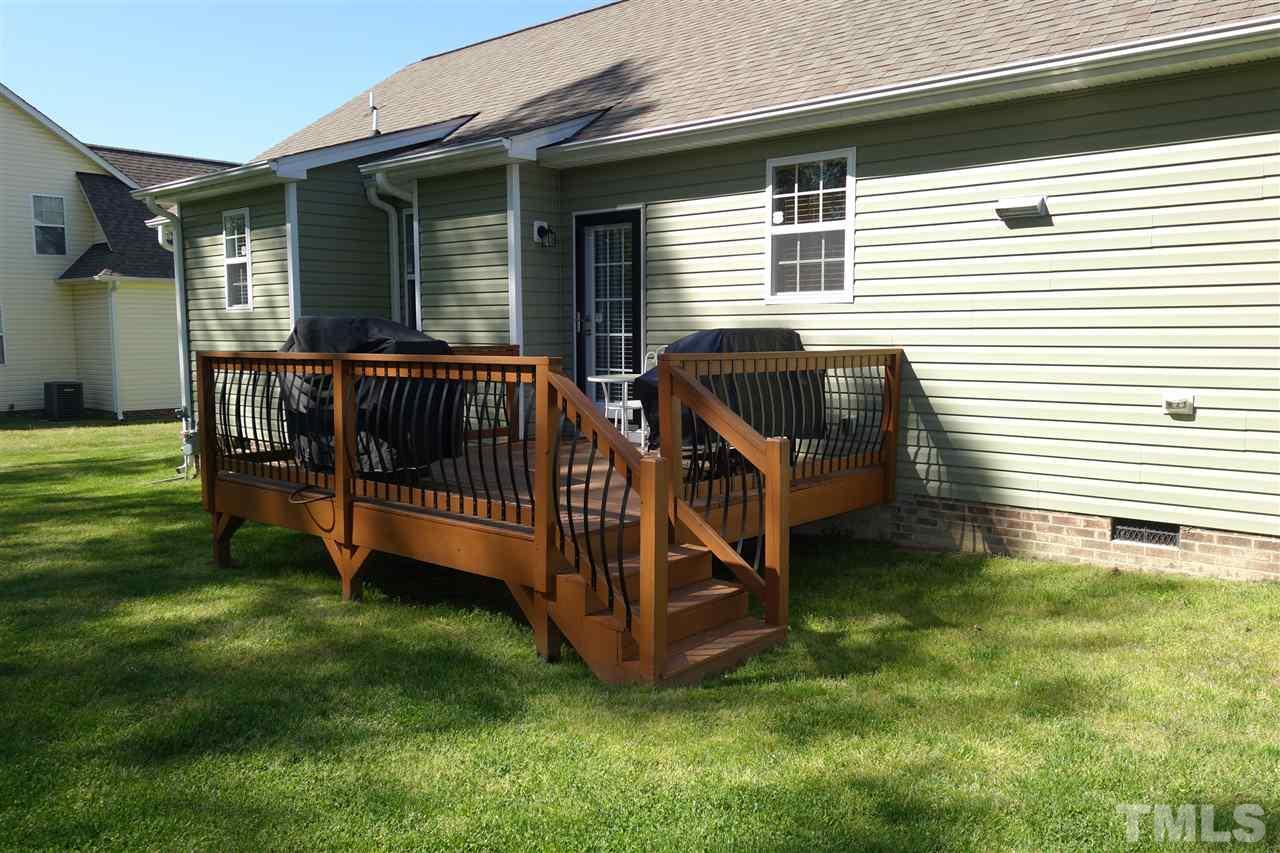 63 West Waycliff Road Henderson, NC 27537 - Photo 23 of 24 On the back of the home is a 12x12 wood deck with access from the family room