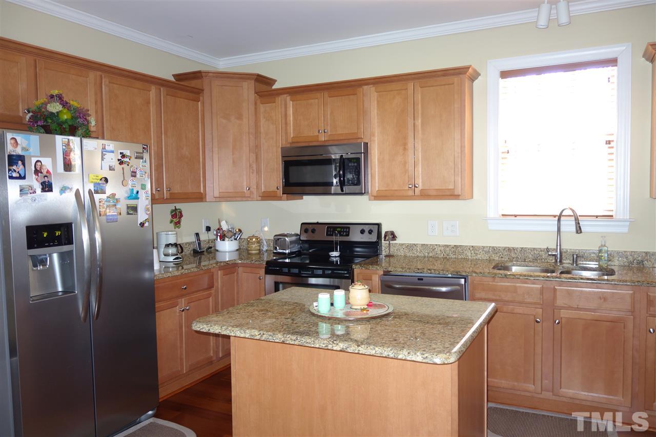 63 West Waycliff Road Henderson, NC 27537 - Photo 8 of 24 The kitchen has a breakfast serving granite counter and tiled floor