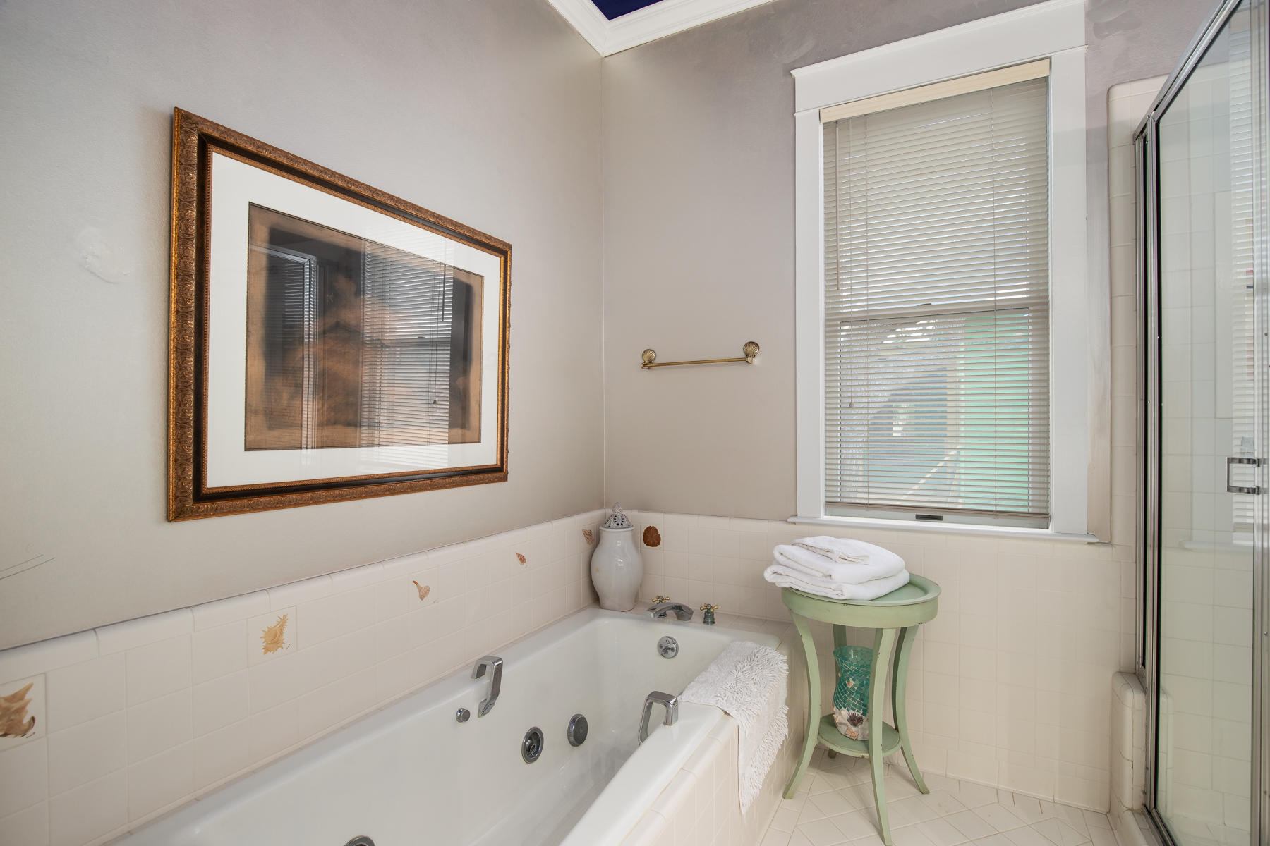 473 Defuniak Street Santa Rosa Beach, FL 32459 - Photo 18 of 28 a bathroom with a bathtub and a window