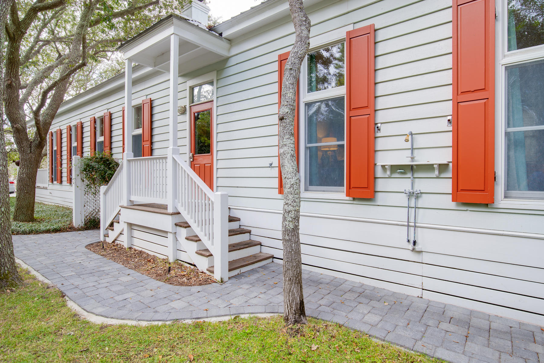 473 Defuniak Street Santa Rosa Beach, FL 32459 - Photo 5 of 28 a view of a house with a small yard and plants