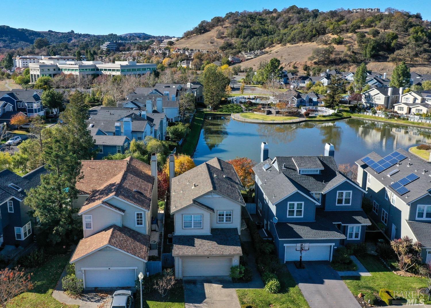 an aerial view of a house with a lake view