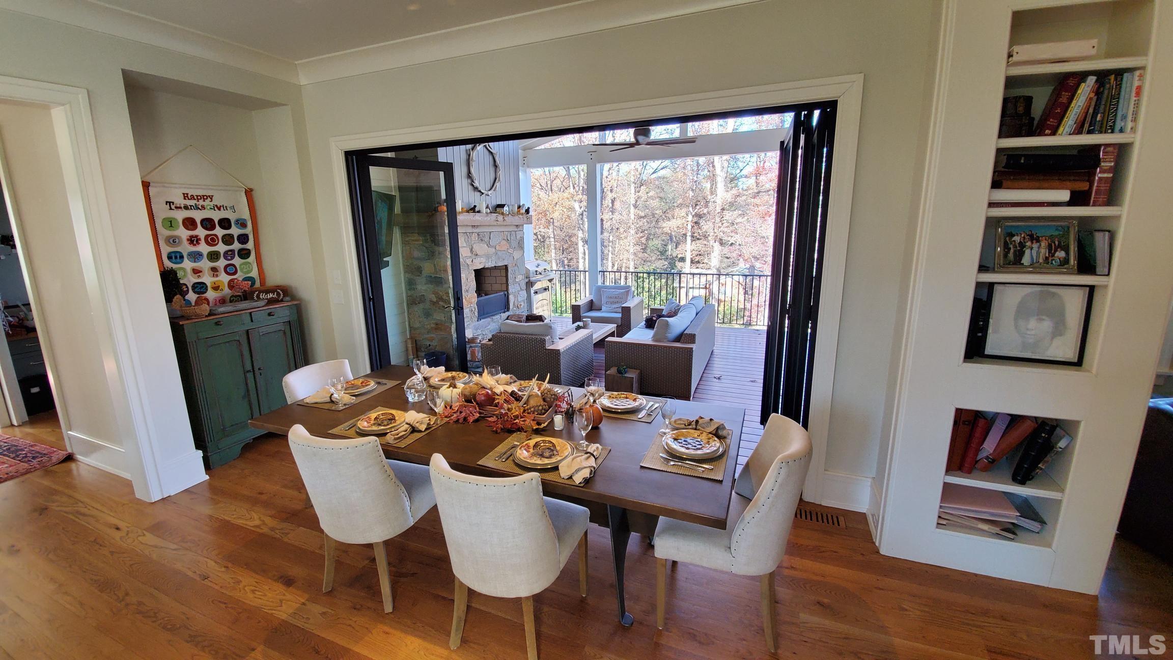 4427 Laurel Hills Road Raleigh, NC 27612 - Photo 11 of 89 a view of a dining room with furniture window and wooden floor