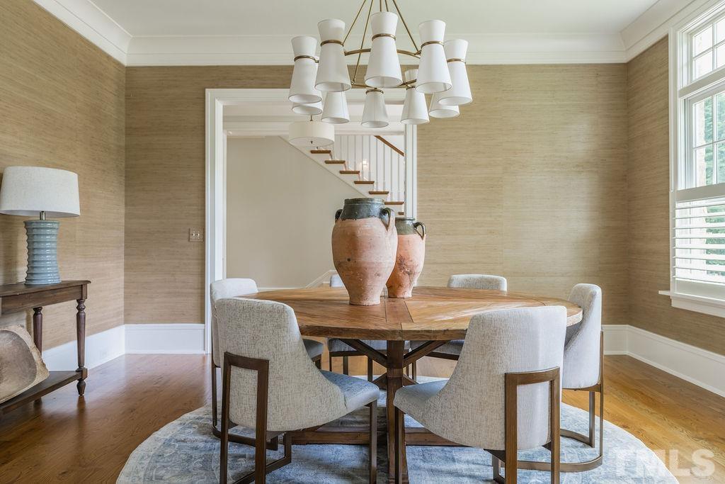 4427 Laurel Hills Road Raleigh, NC 27612 - Photo 42 of 89 a view of a dining room with furniture window and wooden floor