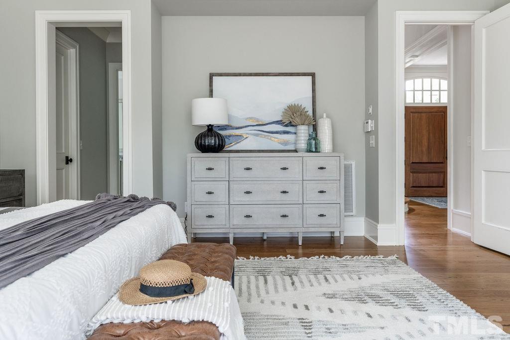 4427 Laurel Hills Road Raleigh, NC 27612 - Photo 48 of 89 a bedroom with a bed and a dresser