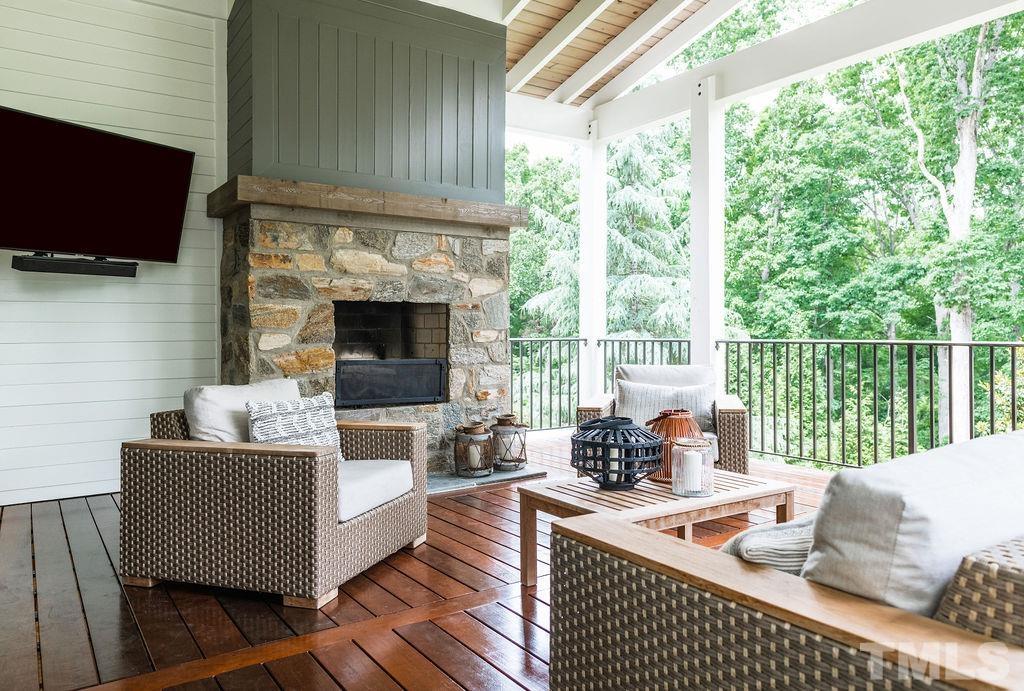 4427 Laurel Hills Road Raleigh, NC 27612 - Photo 56 of 89 a living room with furniture fireplace and a large window