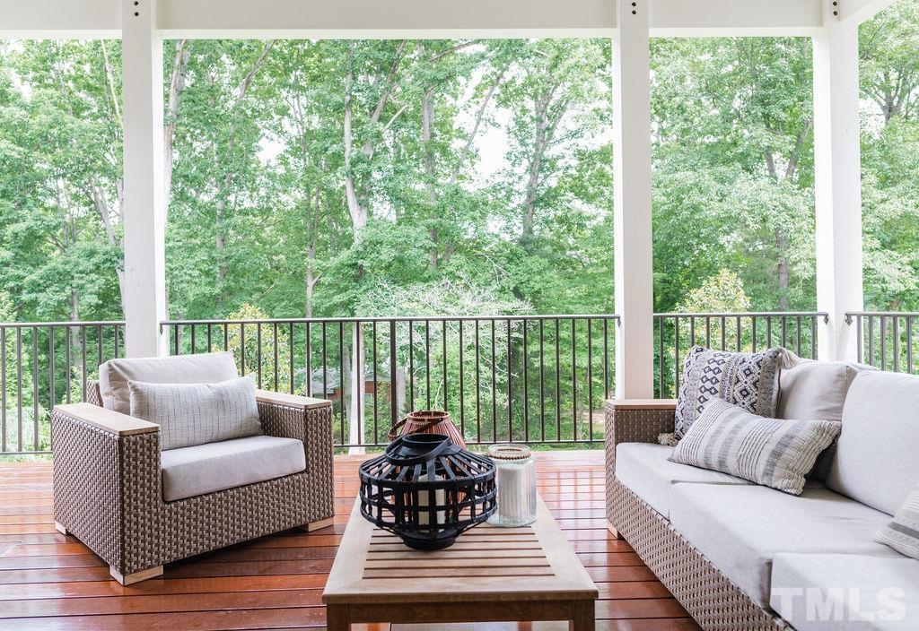 4427 Laurel Hills Road Raleigh, NC 27612 - Photo 57 of 89 a living room with furniture and a large window