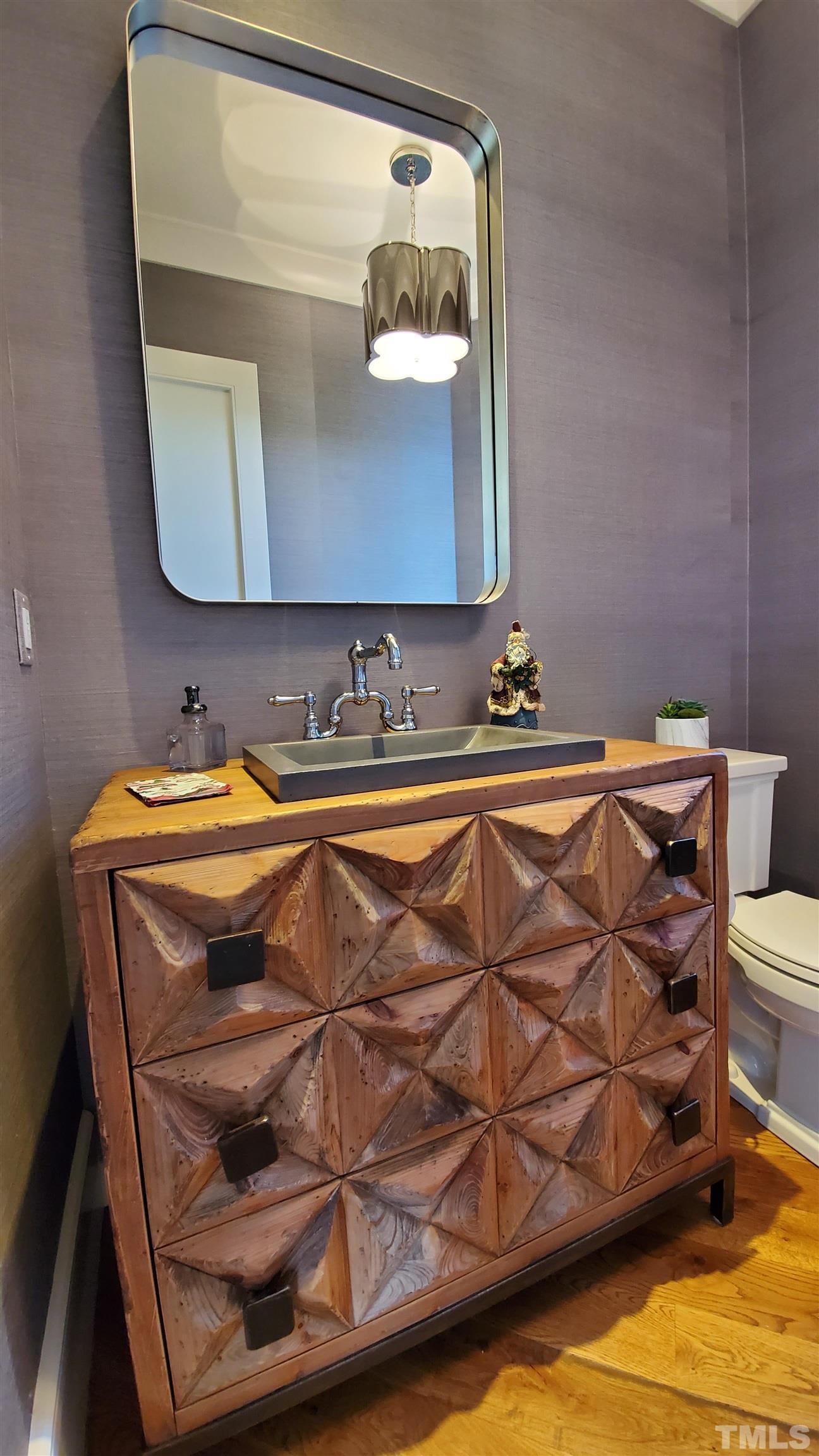 4427 Laurel Hills Road Raleigh, NC 27612 - Photo 6 of 89 a bathroom with a sink and a mirror