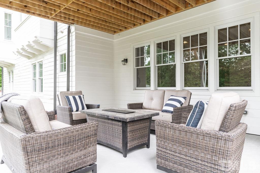 4427 Laurel Hills Road Raleigh, NC 27612 - Photo 63 of 89 a living room with furniture and a large window