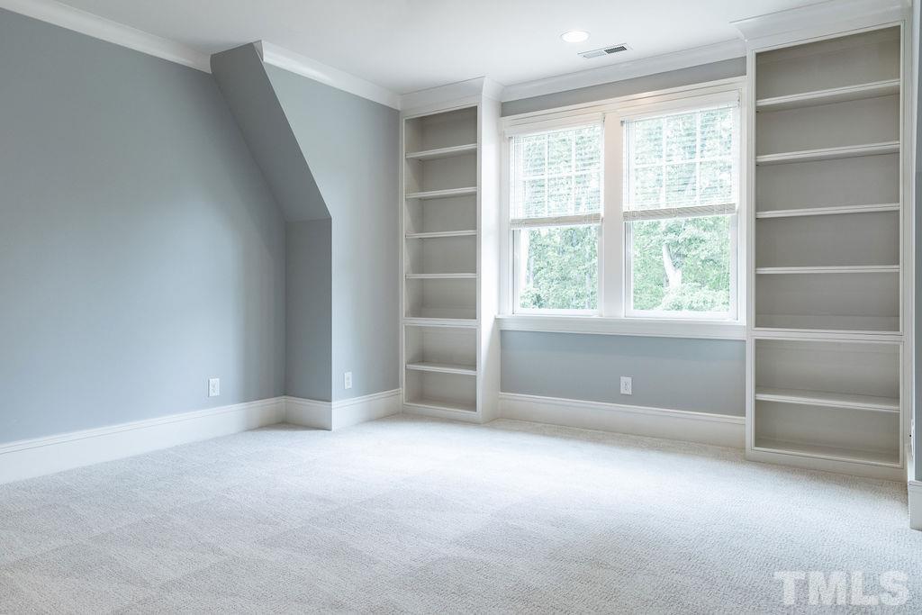 4427 Laurel Hills Road Raleigh, NC 27612 - Photo 67 of 89 a view of an empty room with a window