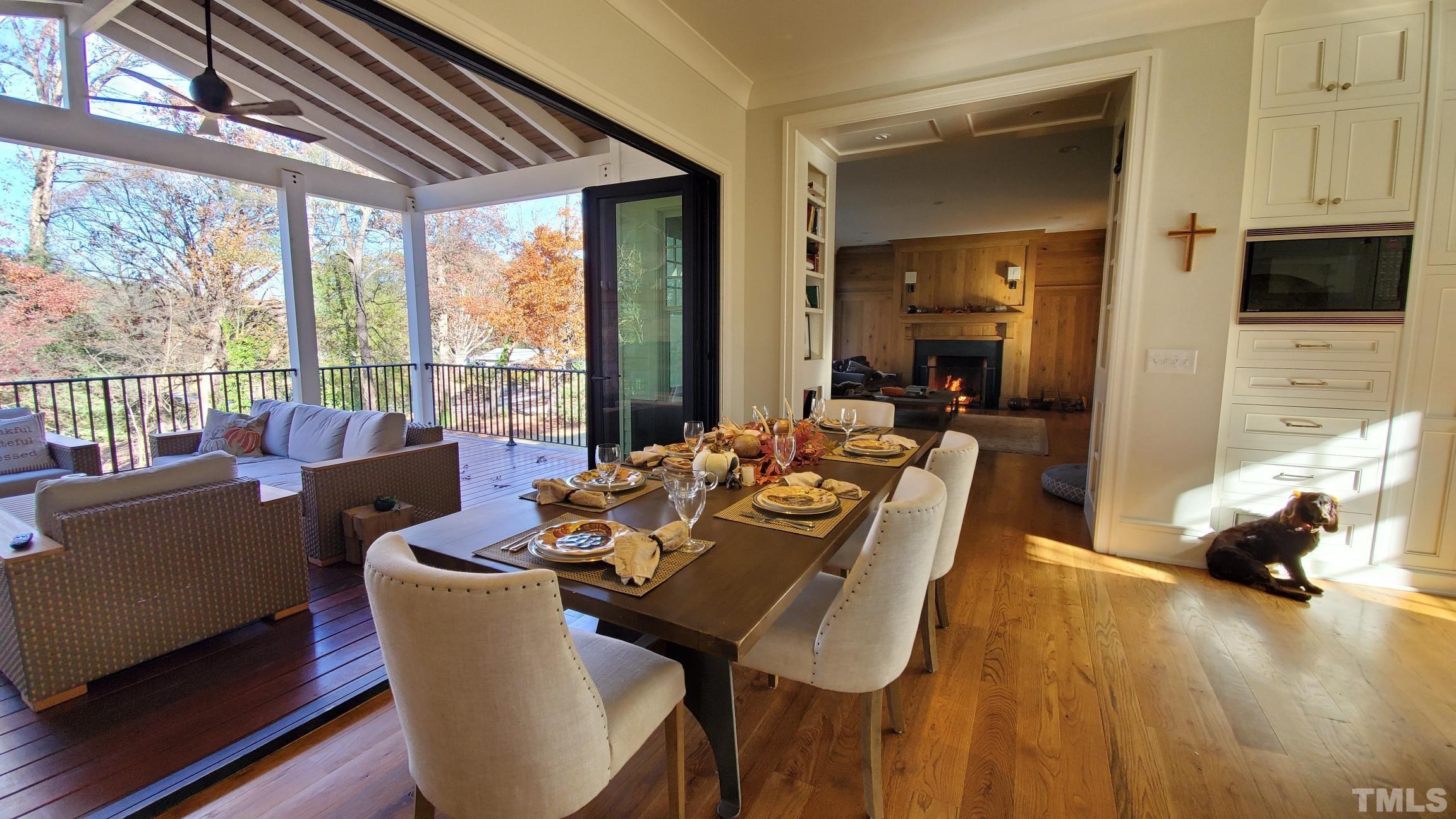 4427 Laurel Hills Road Raleigh, NC 27612 - Photo 10 of 89 a view of a dining room with furniture window and wooden floor