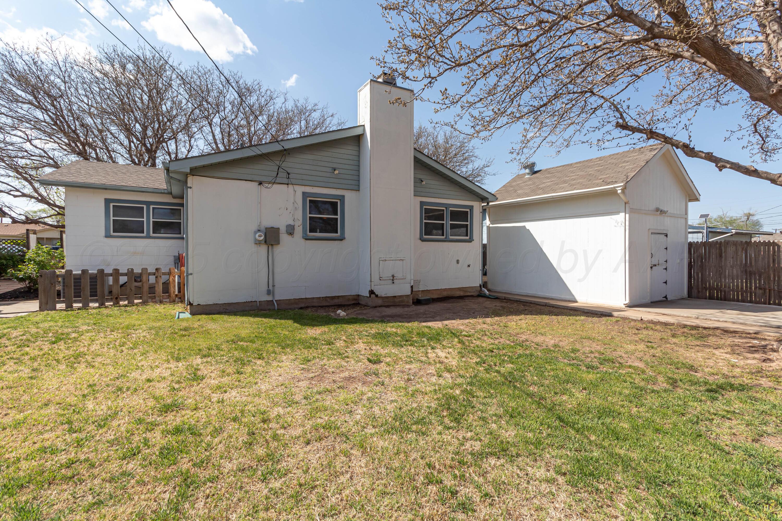 5207 Tumbleweed Drive Amarillo, TX 79110 - Photo 17 of 19 a view of a house with backyard and garden