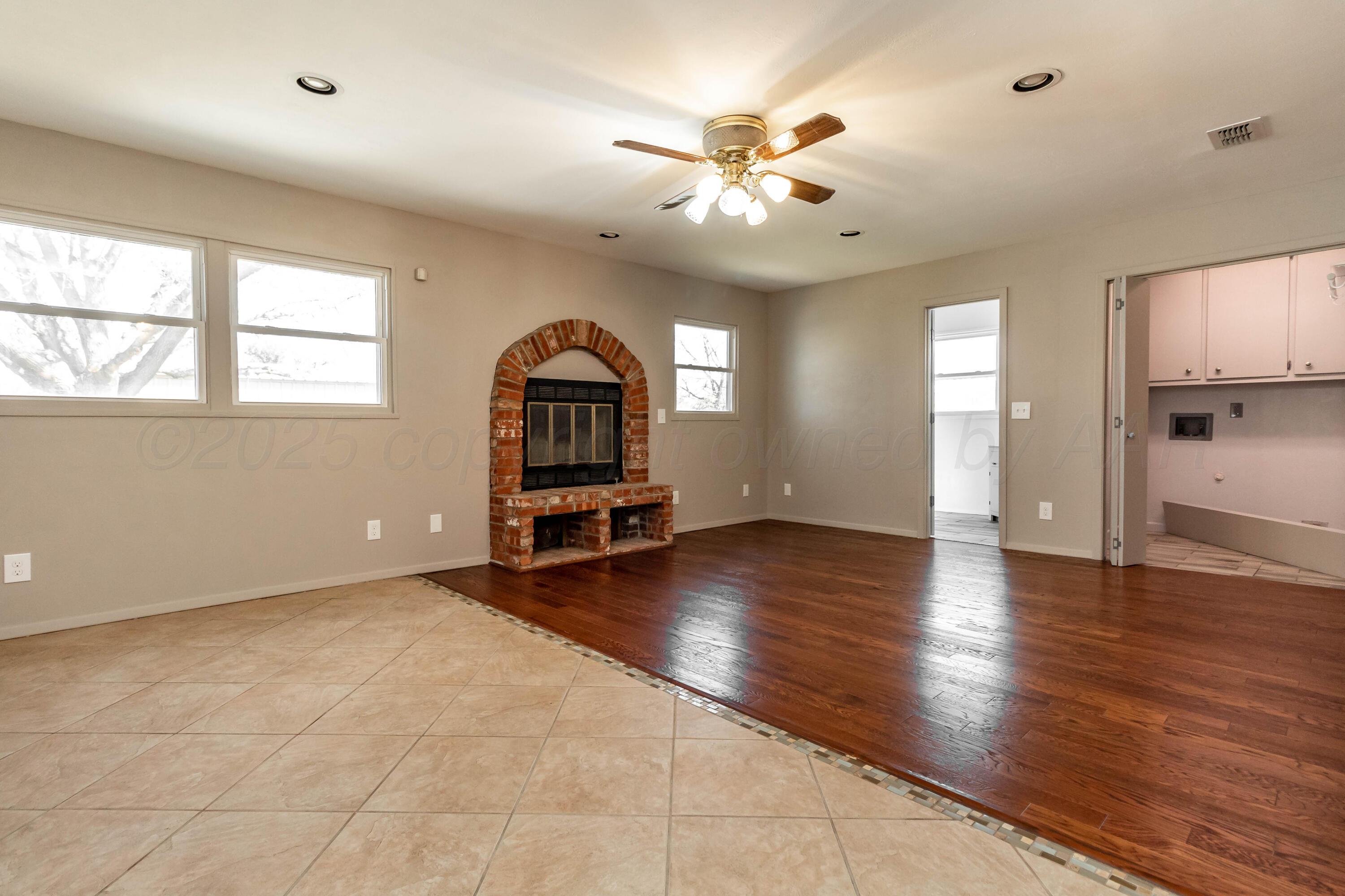 5207 Tumbleweed Drive Amarillo, TX 79110 - Photo 7 of 19 a view of empty room with wooden floor and fan