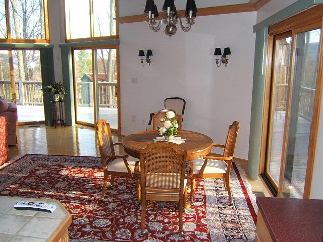 1241 Chester Lane Blue Ridge, VA 24064 - Photo 2 of 7 a view of a dining room with furniture window and wooden floor