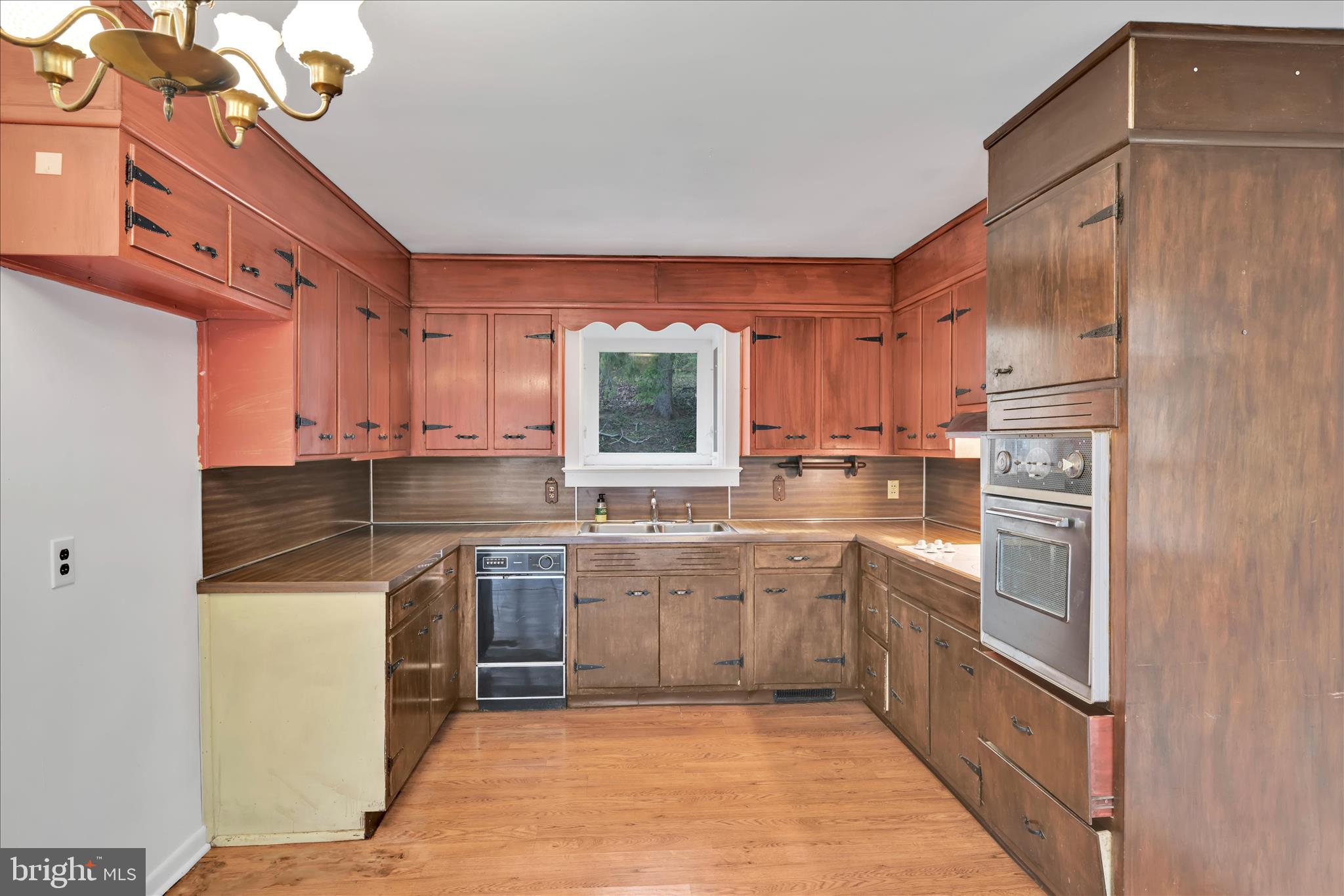 444 North Heidelberg Road Robesonia, PA 19551 - Photo 15 of 59 a kitchen with stainless steel appliances granite countertop a sink and dishwasher a refrigerator with wooden cabinets