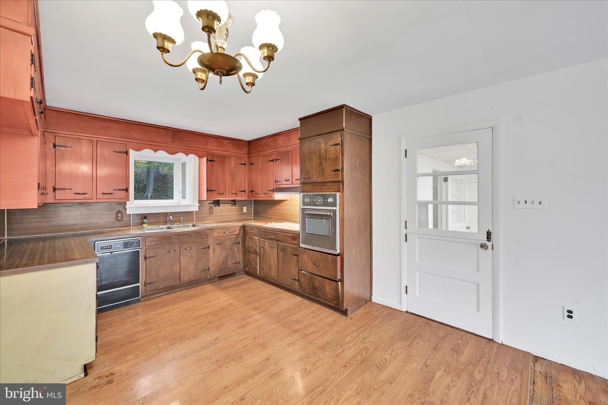 444 North Heidelberg Road Robesonia, PA 19551 - Photo 17 of 59 a kitchen with a refrigerator a sink dishwasher with a dining table and chairs