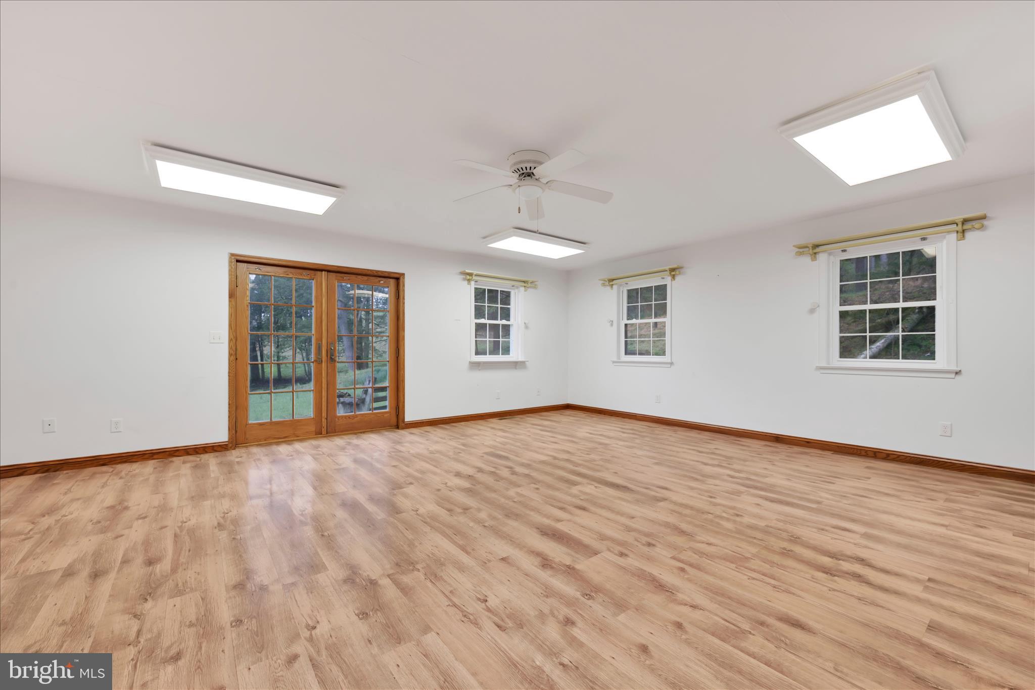 444 North Heidelberg Road Robesonia, PA 19551 - Photo 20 of 59 a view of an empty room with wooden floor and a window