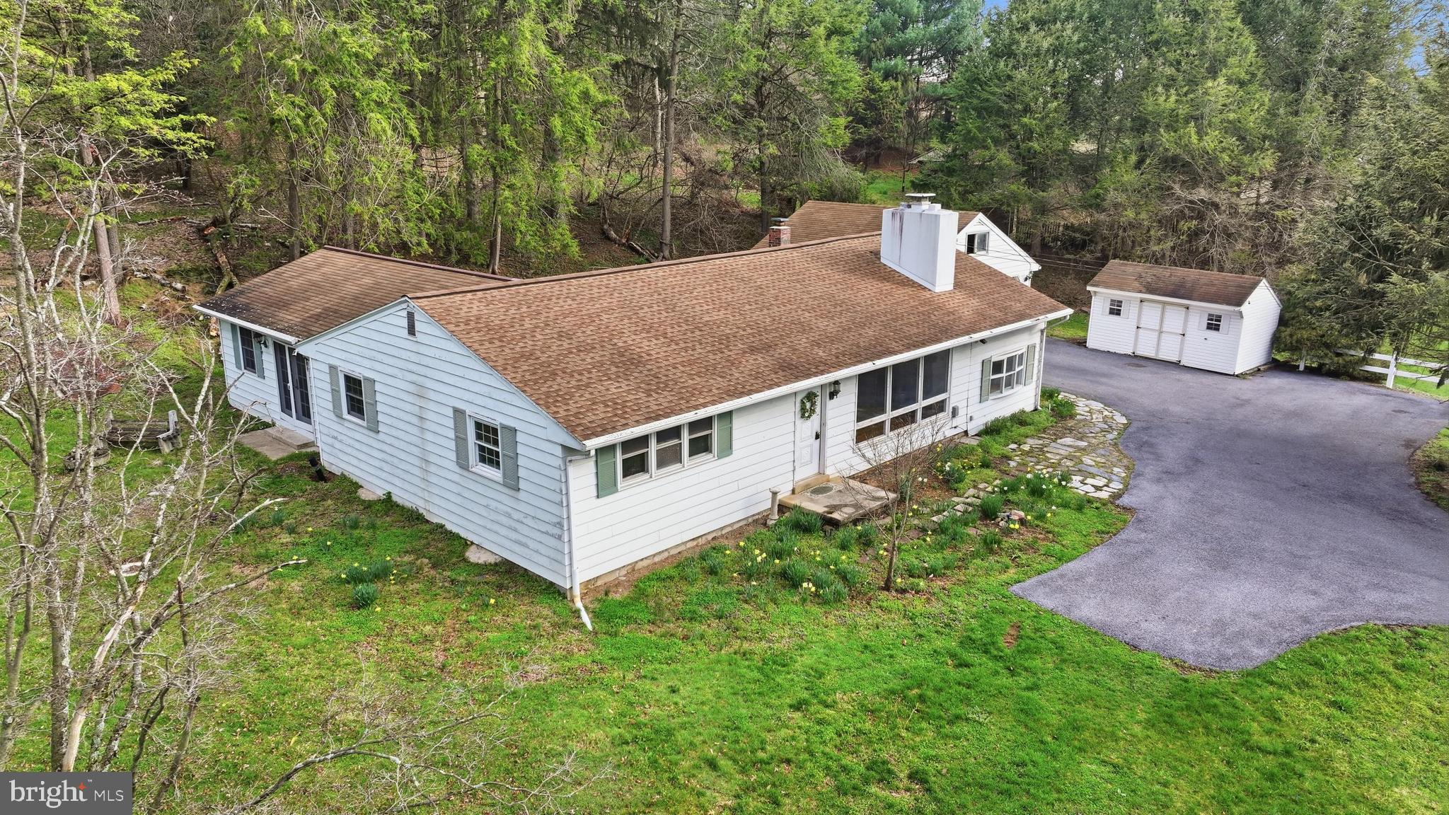 444 North Heidelberg Road Robesonia, PA 19551 - Photo 2 of 59 an aerial view of a house with a big yard and large trees