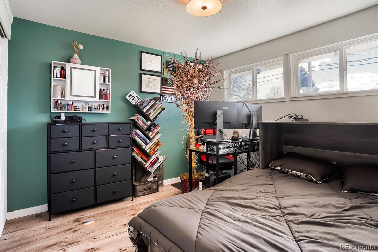 6461 Porter Way Commerce City, CO 80022 - Photo 17 of 23 a bedroom with a bed and furniture