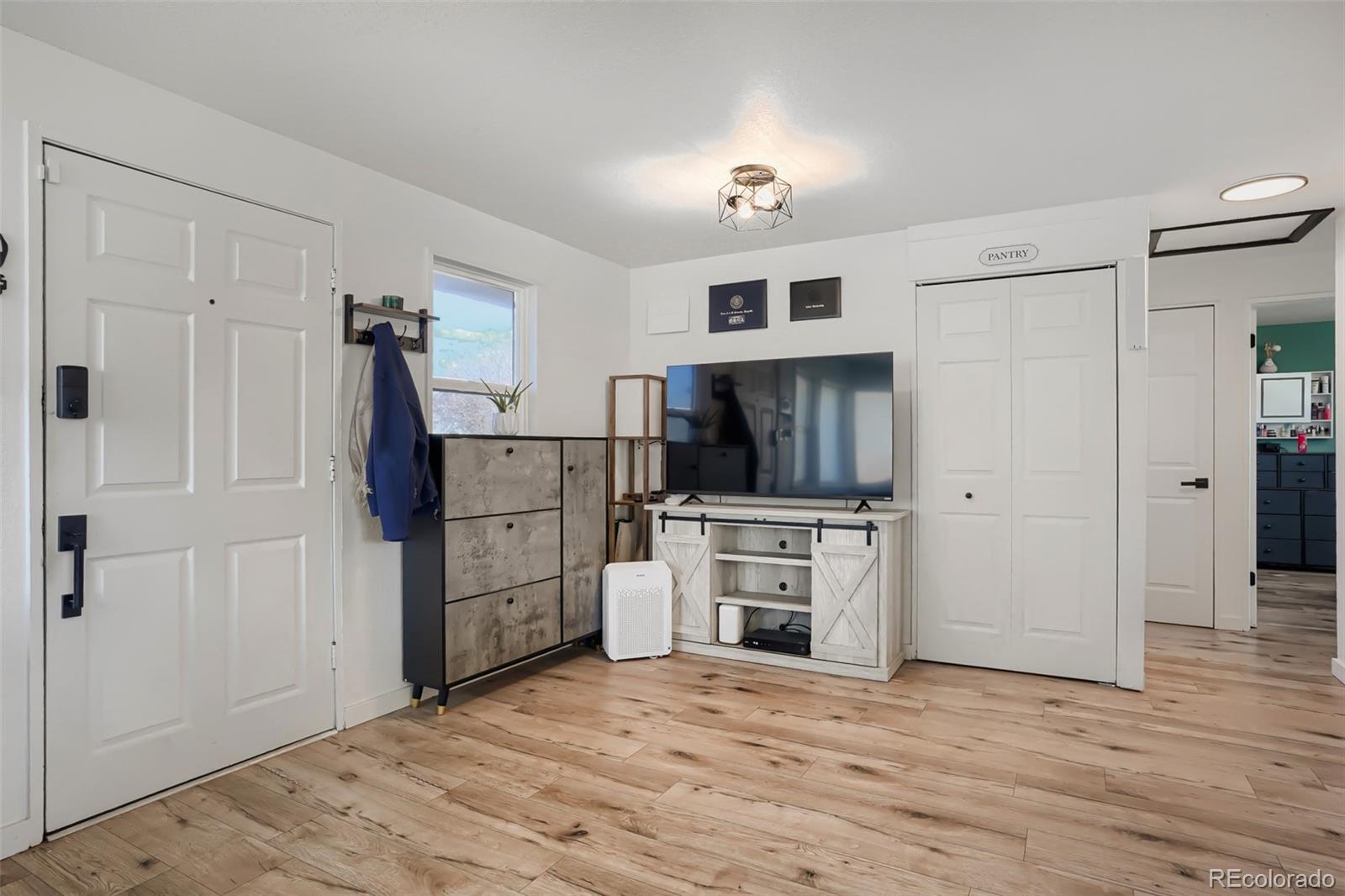 6461 Porter Way Commerce City, CO 80022 - Photo 5 of 23 a view of a kitchen with microwave and cabinets