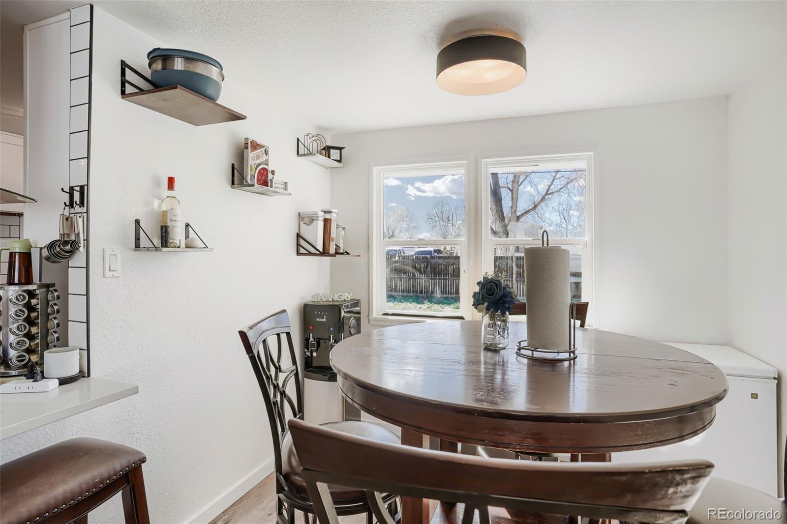 6461 Porter Way Commerce City, CO 80022 - Photo 7 of 23 a view of a dining room with furniture window and outside view