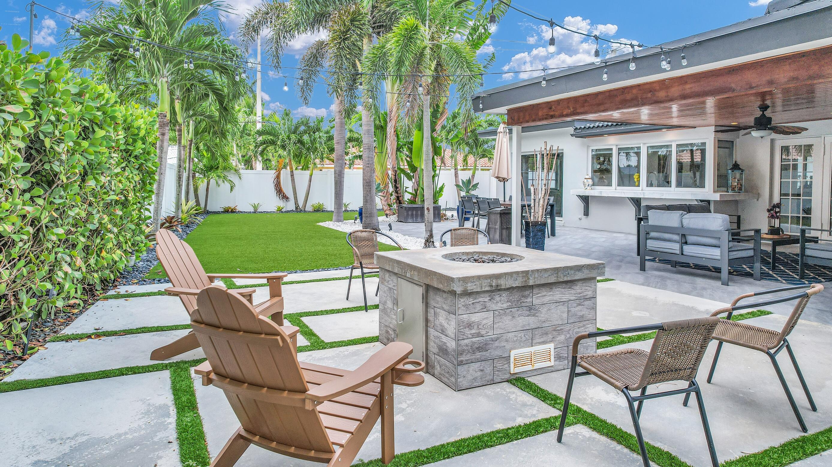 701 Appleby Street Boca Raton, FL 33487 - Photo 24 of 47 a view of a patio with table and chairs and potted plants