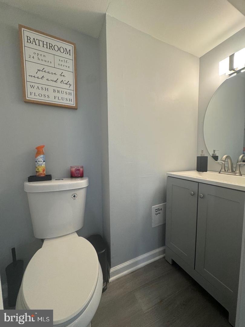 2431 North 50th Street Philadelphia, PA 19131 - Photo 13 of 15 a white toilet sitting next to a bathroom sink