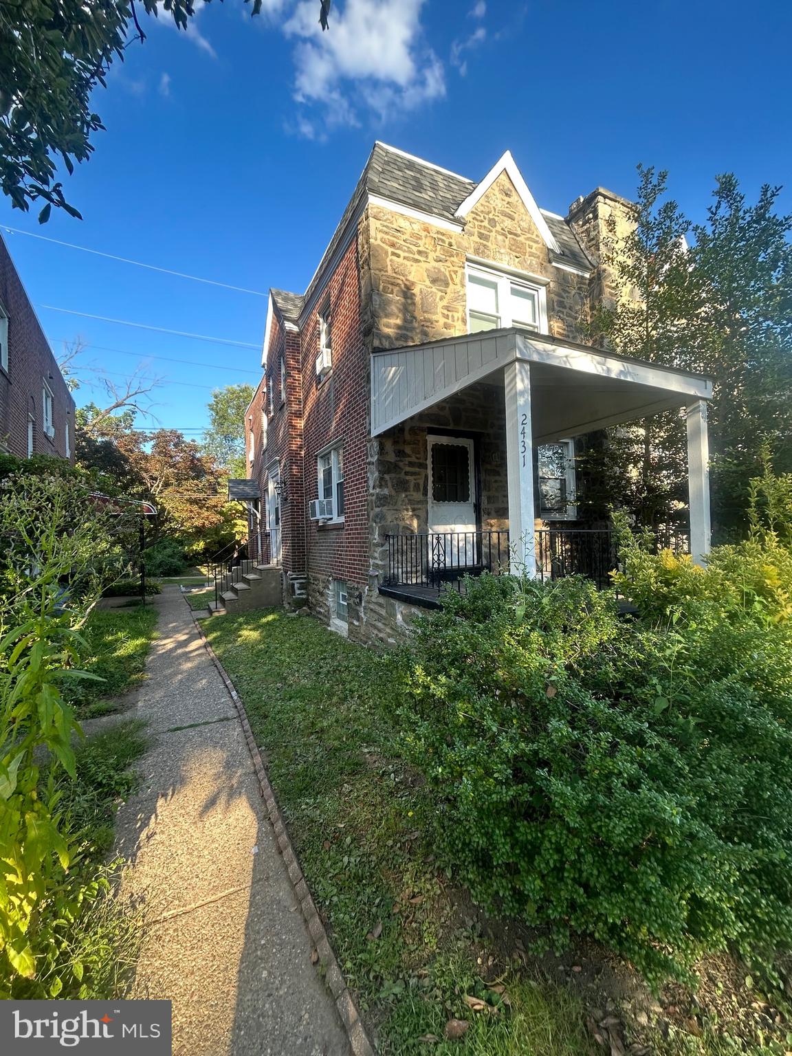 2431 North 50th Street Philadelphia, PA 19131 - Photo 4 of 15 a view of a house with a small yard