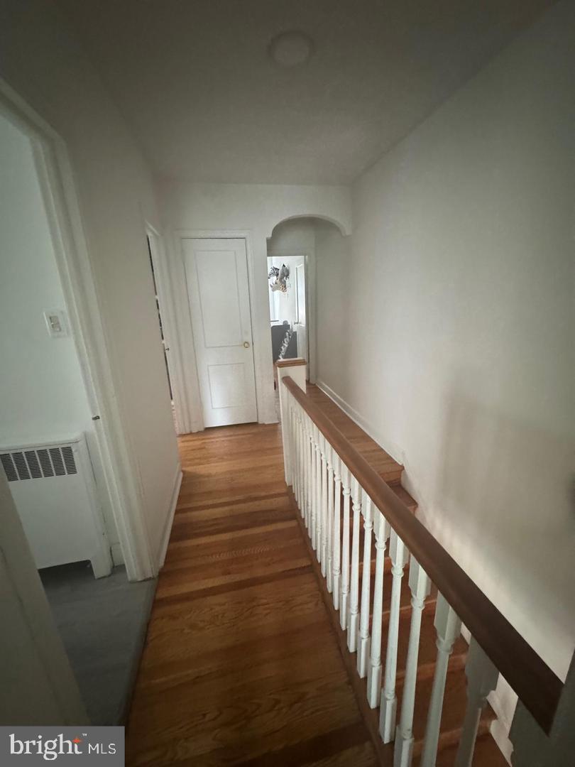 2431 North 50th Street Philadelphia, PA 19131 - Photo 8 of 15 a view of a hallway with wooden floor