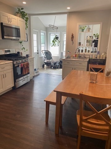1-23 Eastern Avenue Northampton, MA 01060 - Photo 3 of 6 a living room with furniture wooden floor and a flat screen tv