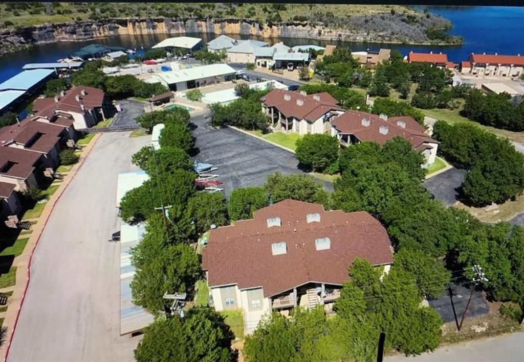 3063 Hells Gate Loop, Unit 23 Strawn, TX 76475 - Photo 16 of 36 an aerial view of house with yard