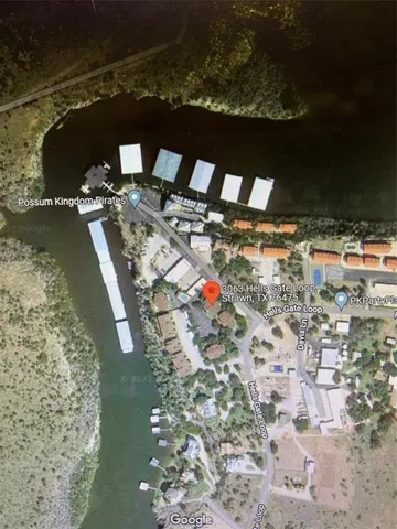 a view of a house with backyard and porch