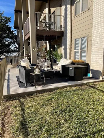 a view of balcony with furniture