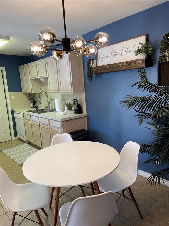 3063 Hells Gate Loop, Unit 23 Strawn, TX 76475 - Photo 2 of 36 a view of a dining room with furniture and chandelier