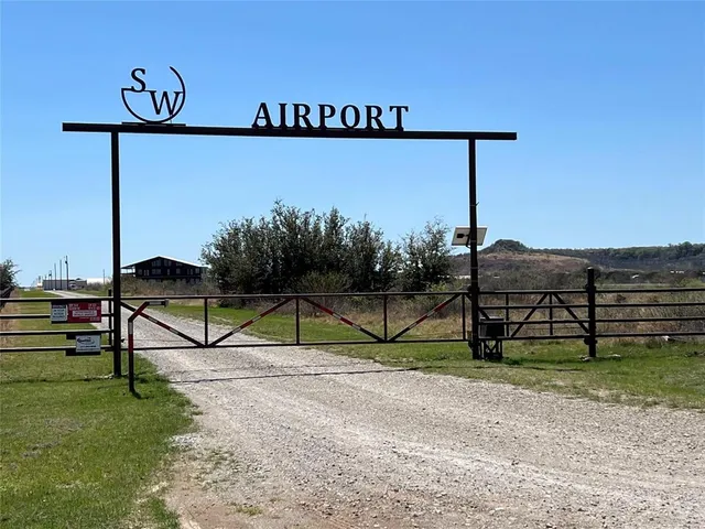a view of a swimming pool with lawn chairs