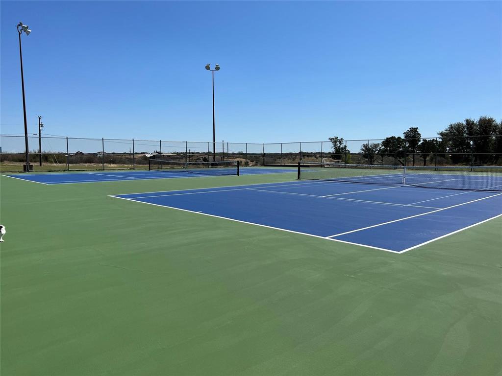 3063 Hells Gate Loop, Unit 23 Strawn, TX 76475 - Photo 34 of 36 a view of a tennis court