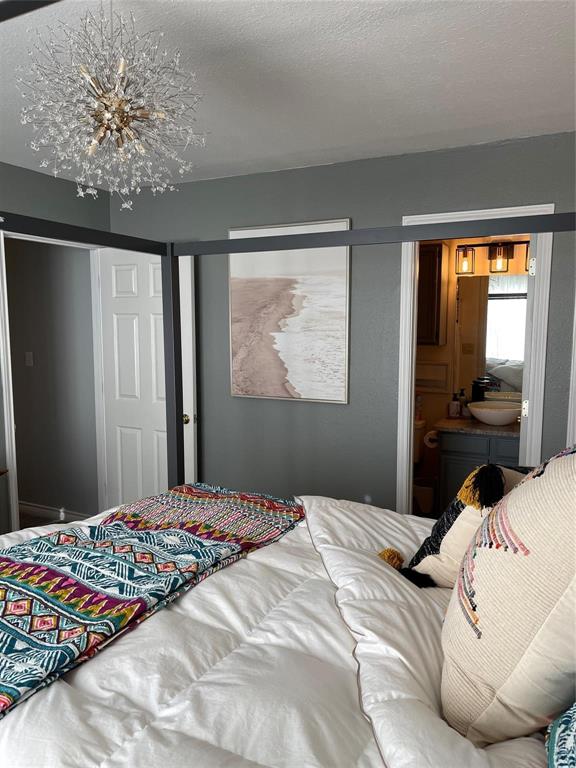 3063 Hells Gate Loop, Unit 23 Strawn, TX 76475 - Photo 6 of 36 a bedroom with a large bed and a window