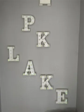 a bedroom with a bed and painting on the wall