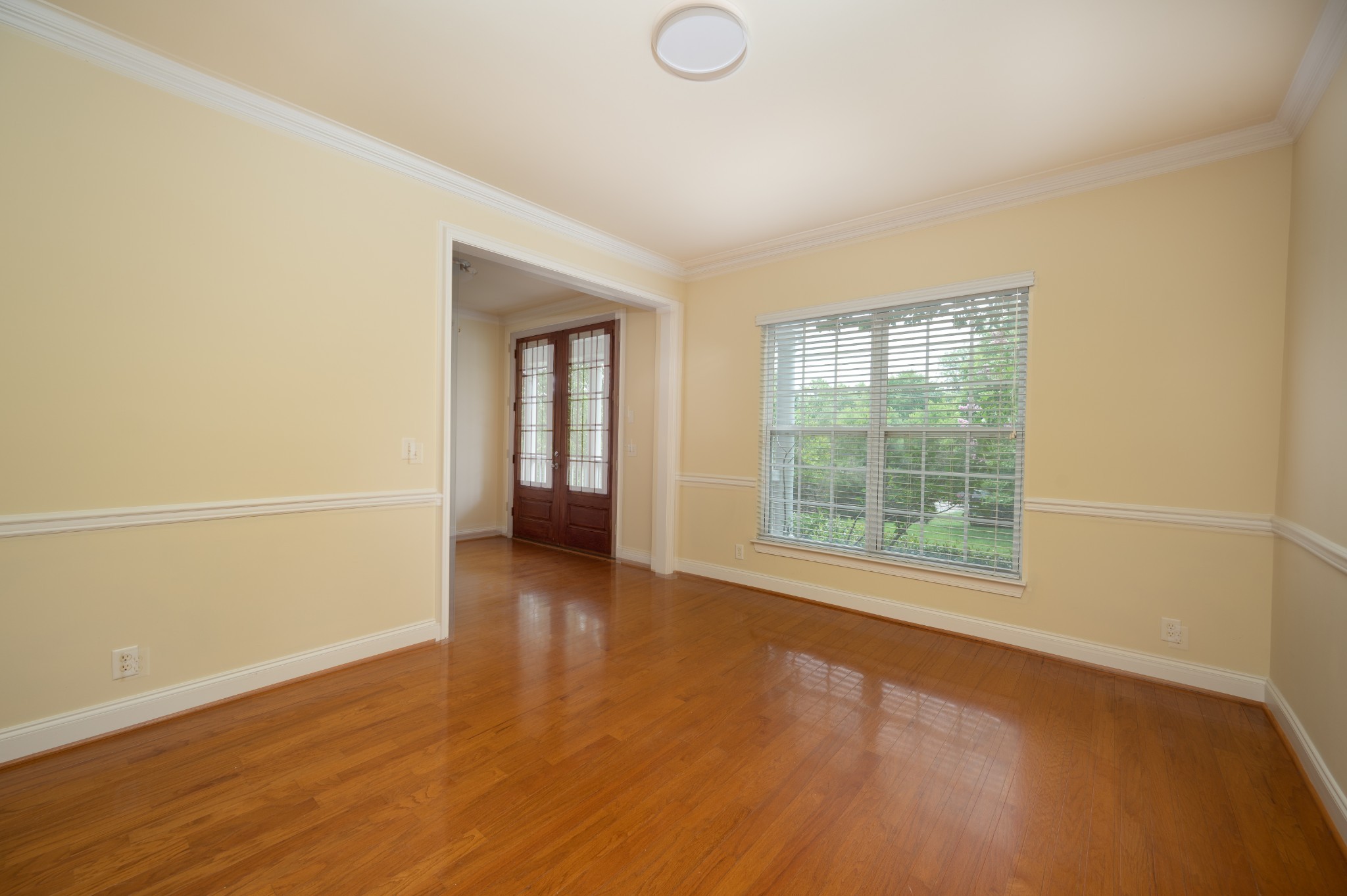 340 Wandering Circle Franklin, TN 37067 - Photo 16 of 51 an empty room with wooden floor and windows