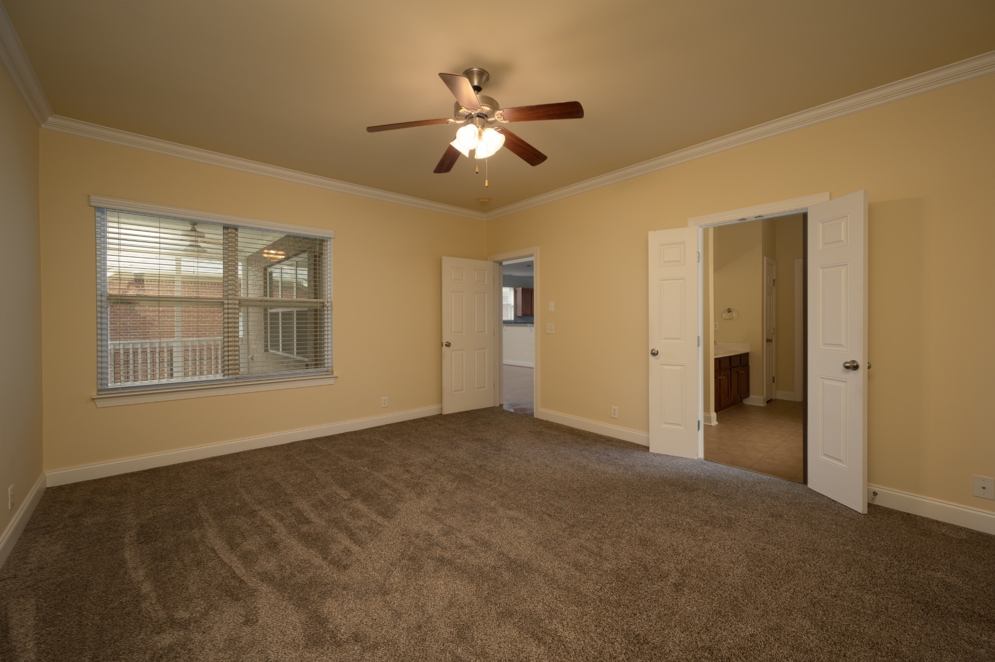 340 Wandering Circle Franklin, TN 37067 - Photo 26 of 51 a view of an empty room with chandelier fan and fire place