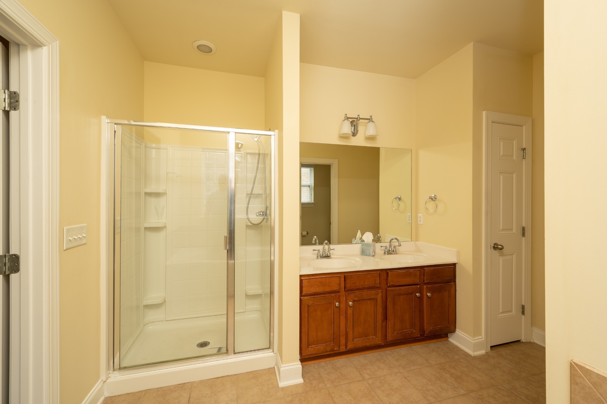340 Wandering Circle Franklin, TN 37067 - Photo 27 of 51 a bathroom with a double vanity sink a mirror and a shower