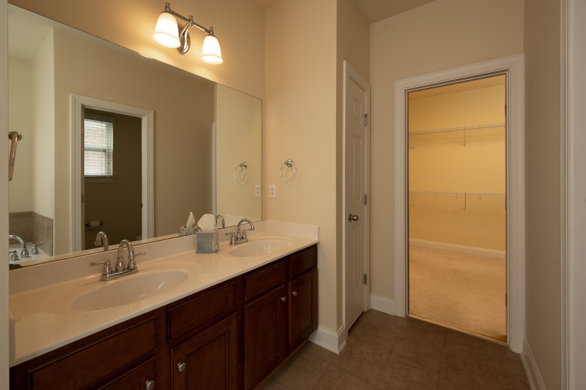 340 Wandering Circle Franklin, TN 37067 - Photo 29 of 51 a bathroom with a double vanity sink and a mirror