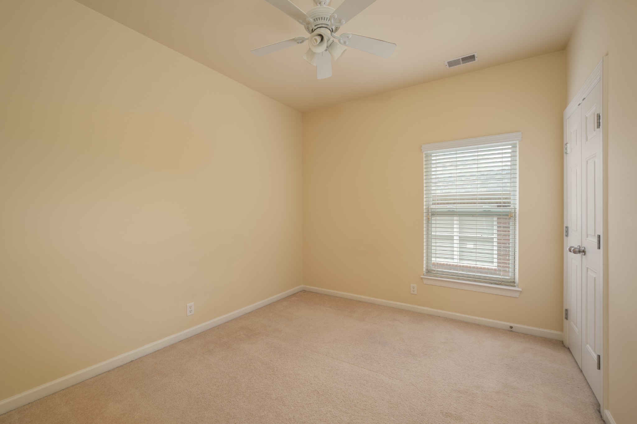 340 Wandering Circle Franklin, TN 37067 - Photo 42 of 51 an empty room with a window and a ceiling fan