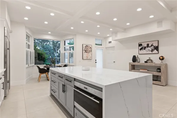 a kitchen with a stove a sink and a refrigerator