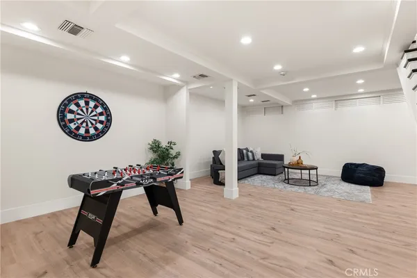 a hallway with a table and a chair