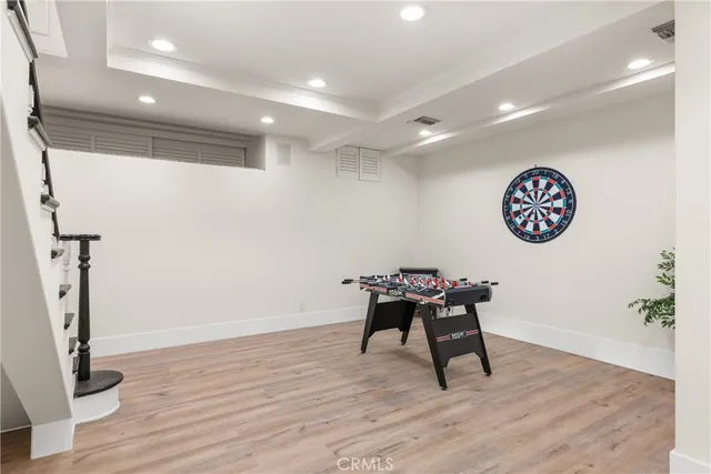 a view of a workspace with furniture and wooden floor