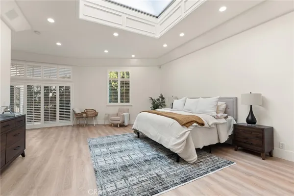 a bedroom with double bed and a couch