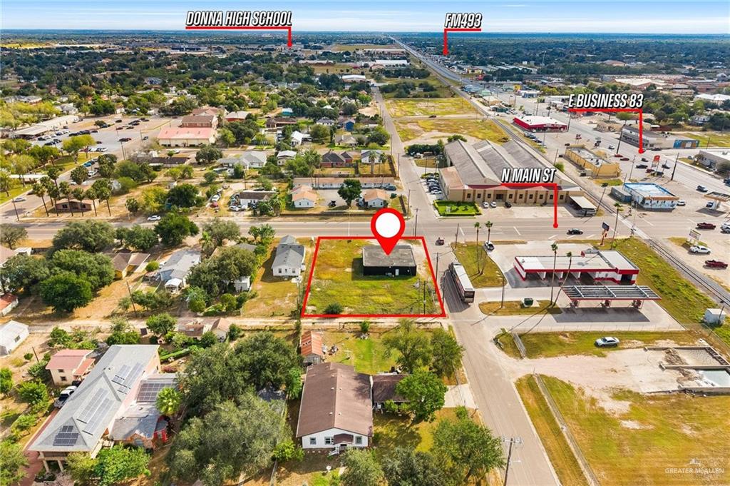 103 North Main Street Donna, TX 78537 - Photo 7 of 10 an aerial view of residential houses with outdoor space